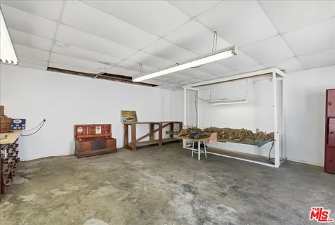 a bed room with furniture and a large window