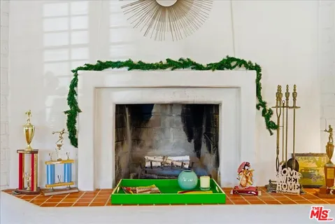 a shelf with books and knick knacks on it