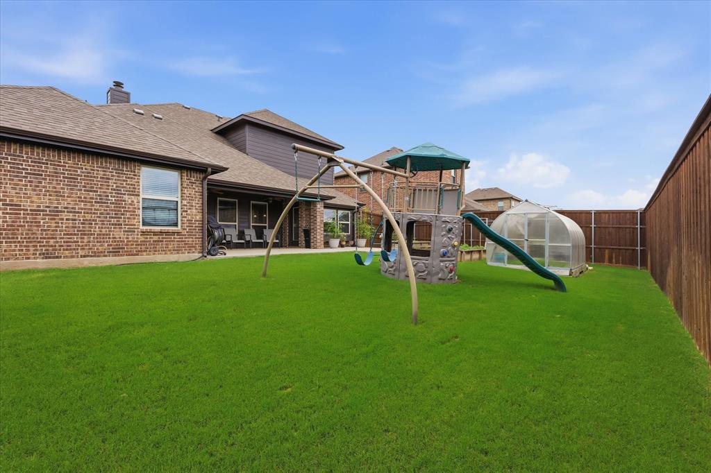 1105 Safrano Street Midlothian, TX 76065 - Photo 21 of 25 a view of a house with a big yard