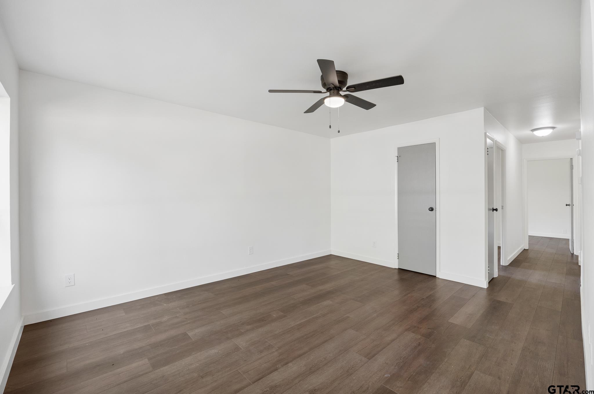 1538 North Hill Road Tyler, TX 75702 - Photo 5 of 29 a view of a big room with wooden floor closet and windows