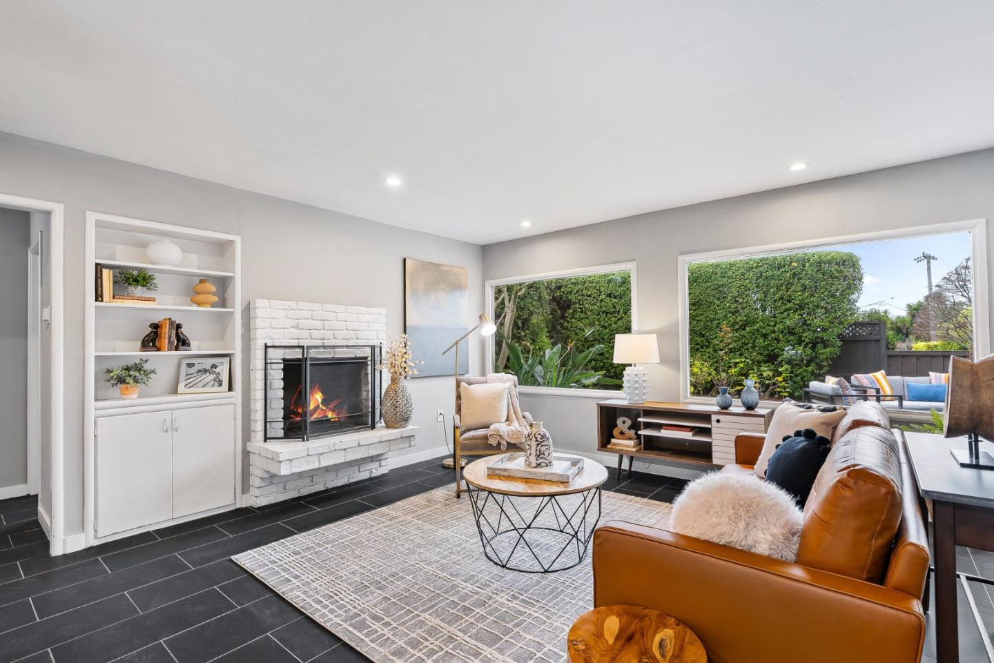 a living room with furniture and a fireplace