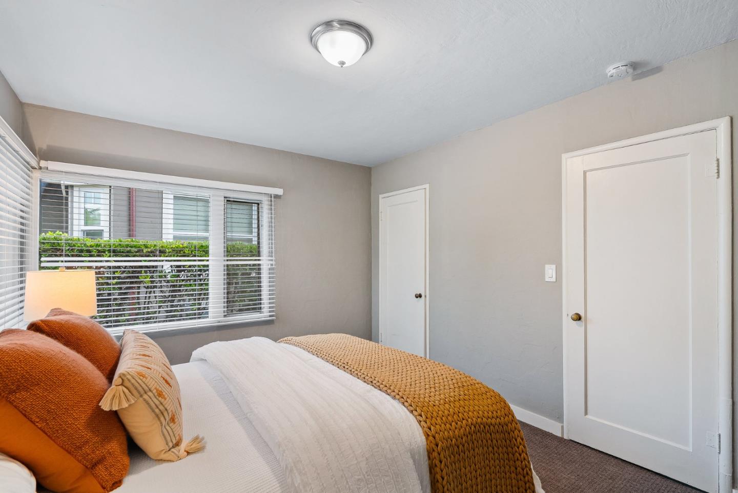 214 Martin Drive Aptos, CA 95003 - Photo 12 of 33 a bedroom with a bed and a large window