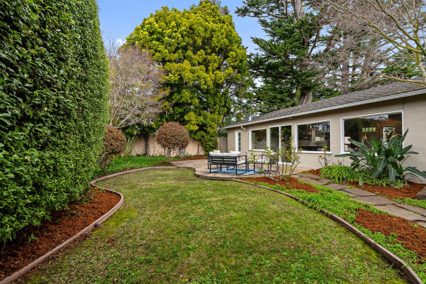 214 Martin Drive Aptos, CA 95003 - Photo 20 of 33 a view of a house with backyard sitting area and garden