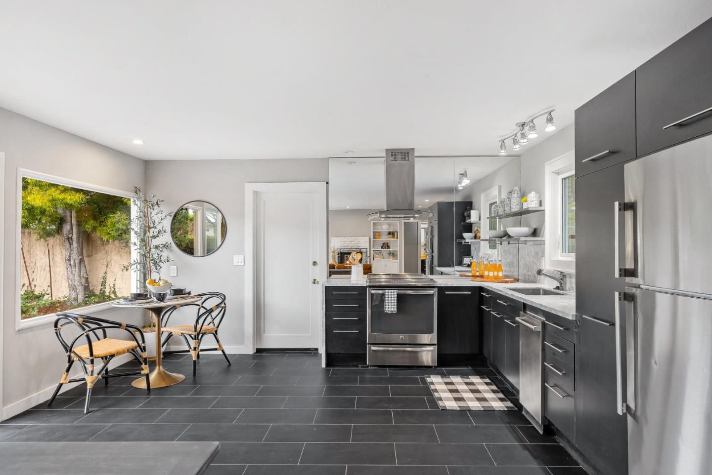 214 Martin Drive Aptos, CA 95003 - Photo 7 of 33 a kitchen with stainless steel appliances a stove a sink a refrigerator and chairs
