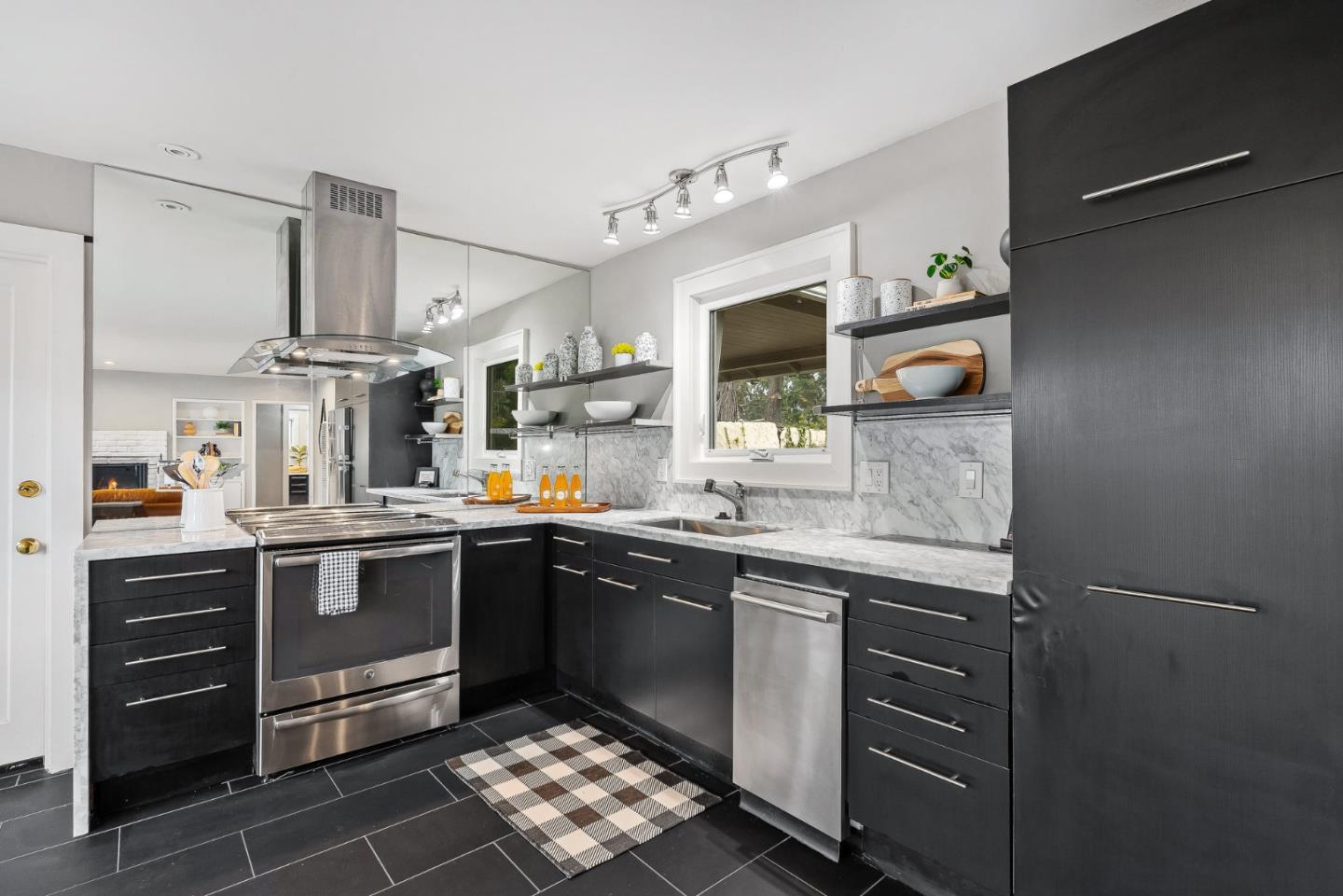 214 Martin Drive Aptos, CA 95003 - Photo 8 of 33 a kitchen with stainless steel appliances granite countertop a sink and stove top oven