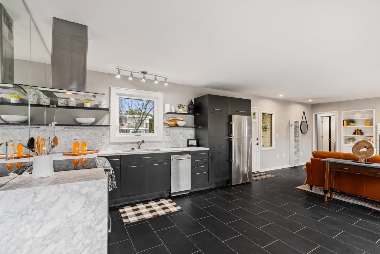 214 Martin Drive Aptos, CA 95003 - Photo 10 of 33 a kitchen with stainless steel appliances granite countertop a sink stove and refrigerator