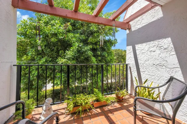 a view of a chairs and table in the patio