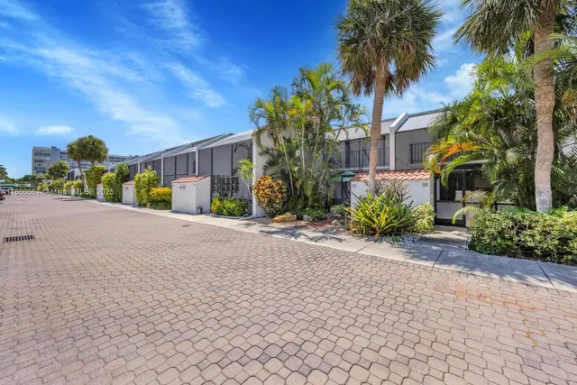 a view of a street with a building in the background