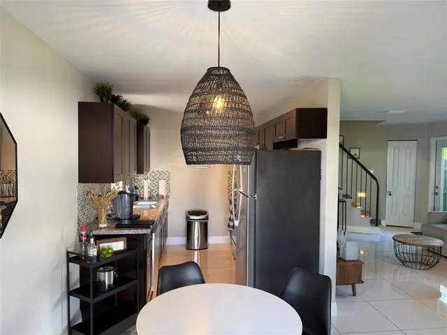 a kitchen with stainless steel appliances a refrigerator and a stove