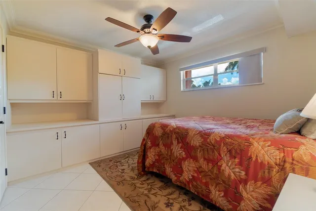 a bathroom with a granite countertop toilet a sink and a mirror