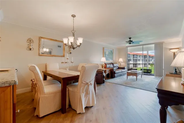 a kitchen with kitchen island granite countertop a stove and a sink