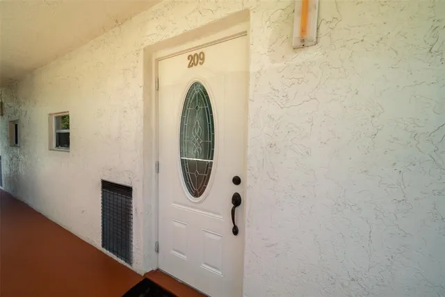 a view of a park with large trees