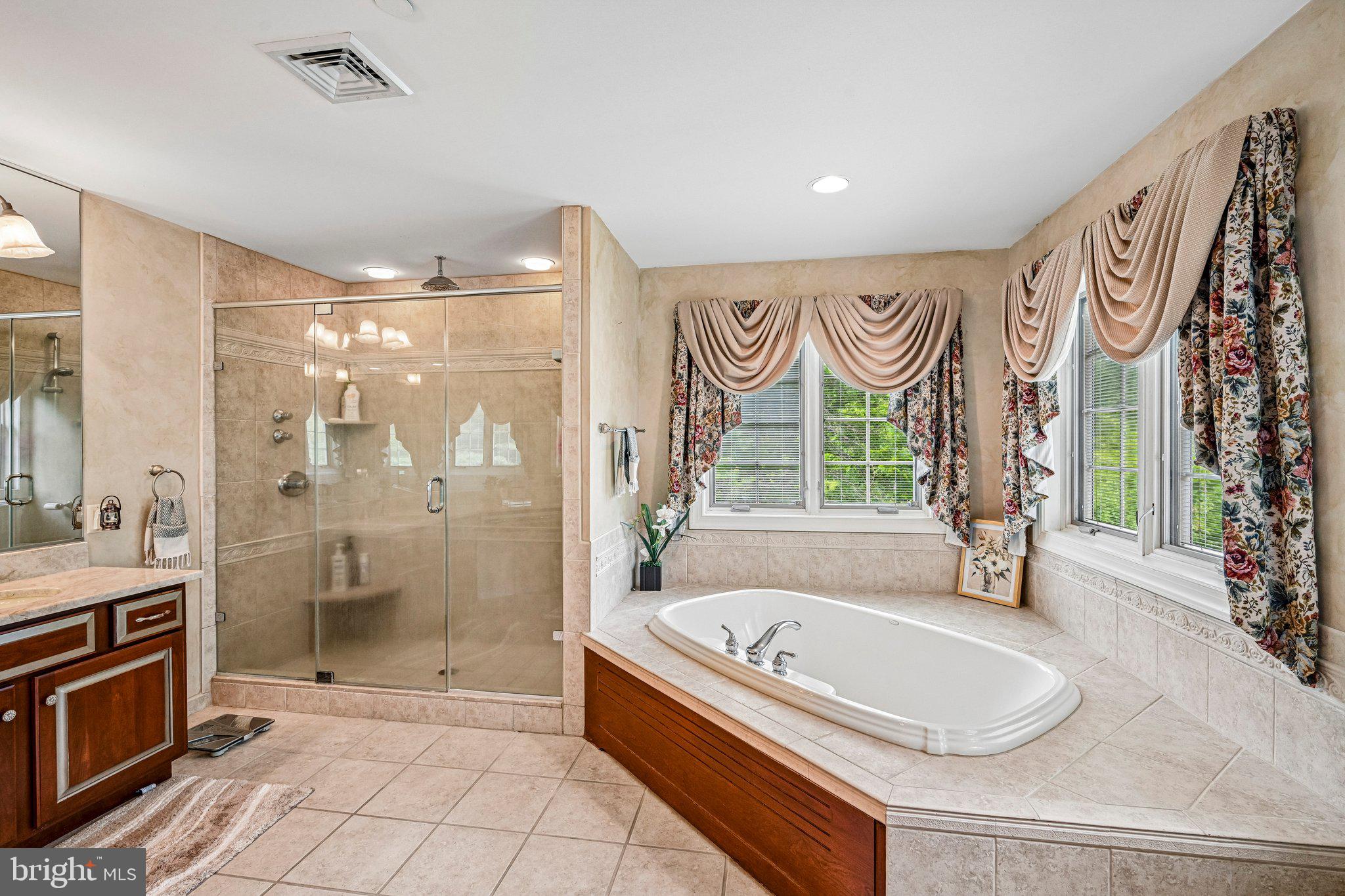 434 Meetinghouse Road Ambler, PA 19002 - Photo 27 of 51 a bathroom with a granite countertop tub sink a mirror and a shower