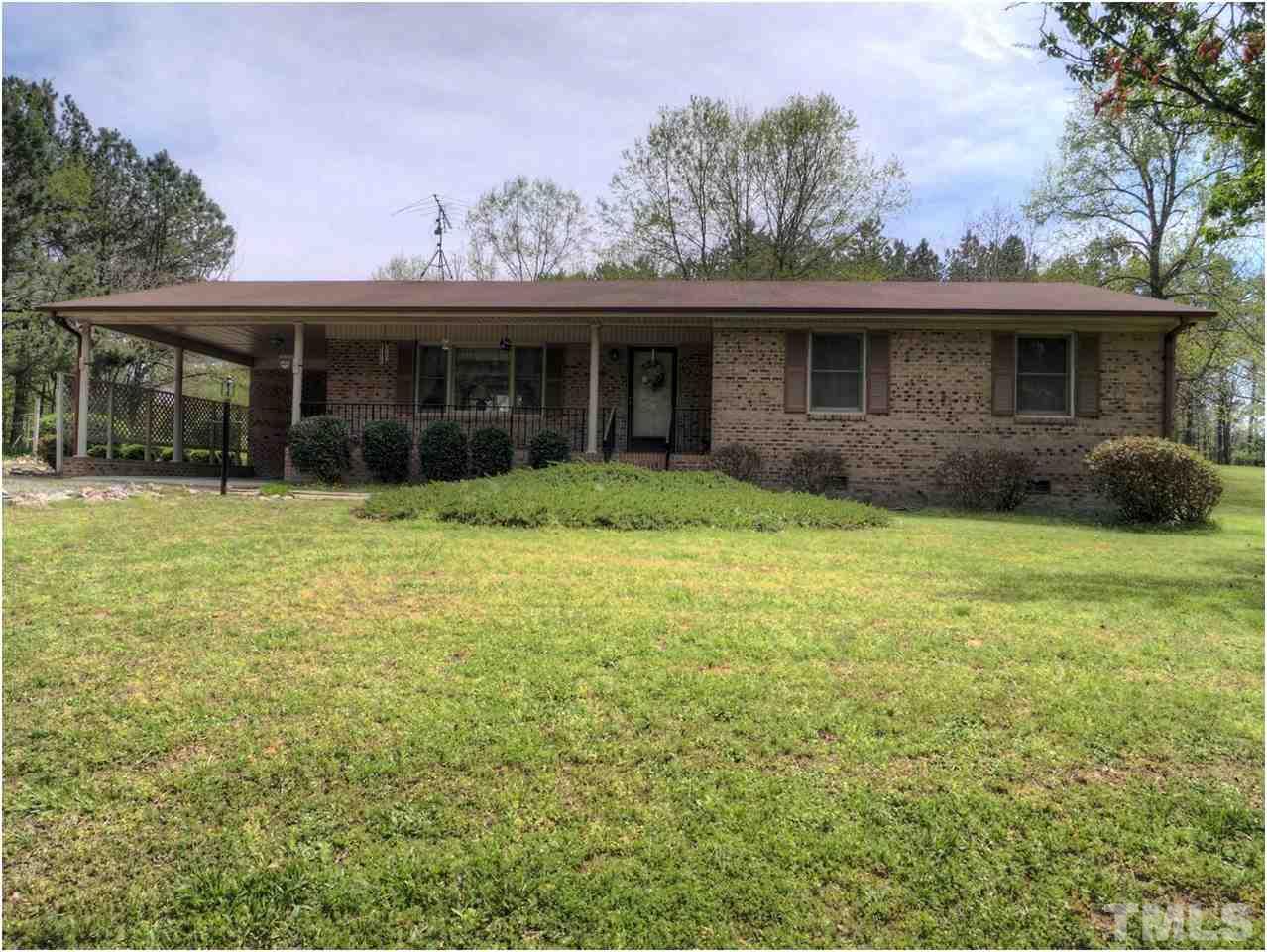 1566 Northside Road Creedmoor, NC 27522 - Photo 1 of 24 Elegant all brick ranch with front porch and carport. 2+ acres . Huge garage/shop. Private location. Serene setting. Patio in rear. Minutes from either N. Raleigh or N. to town of Creedmoor. Close to all amenities and highway access.