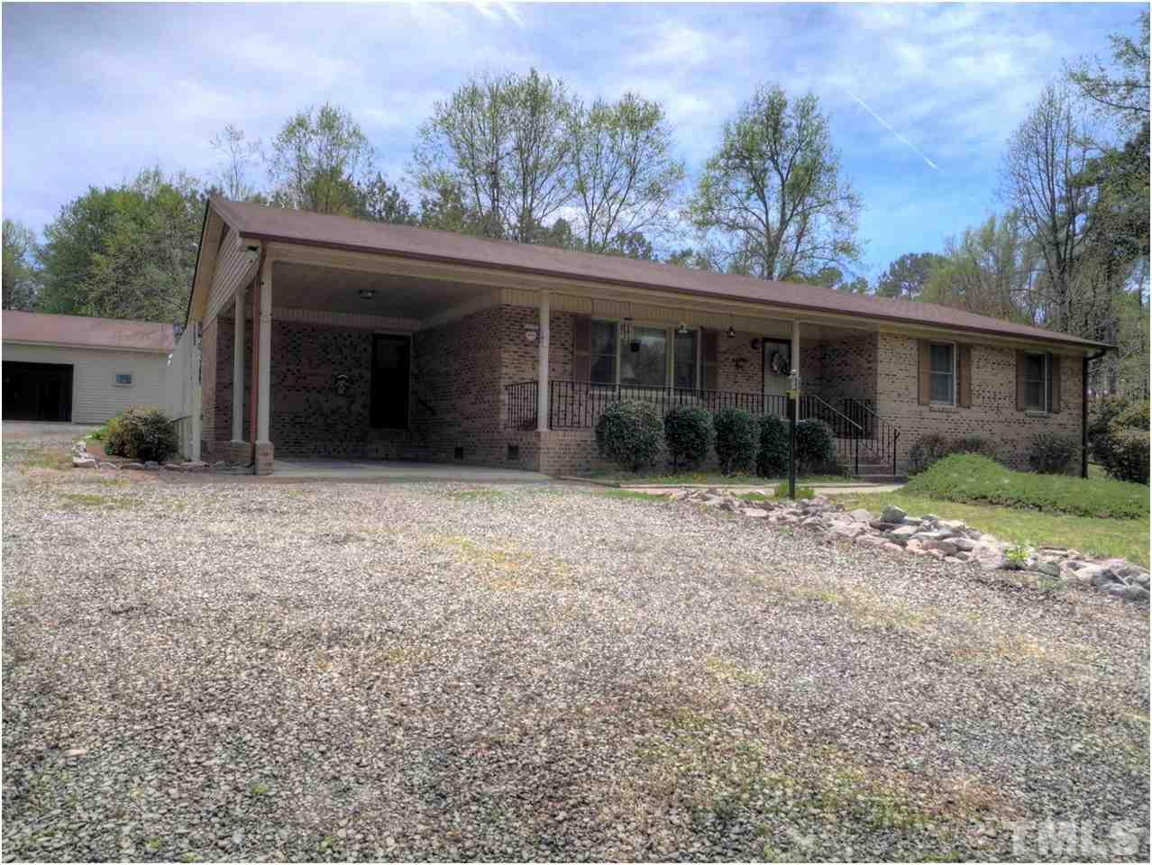 1566 Northside Road Creedmoor, NC 27522 - Photo 2 of 24 Convenient carport...could easily be further enclosed. Enters into mudroom.