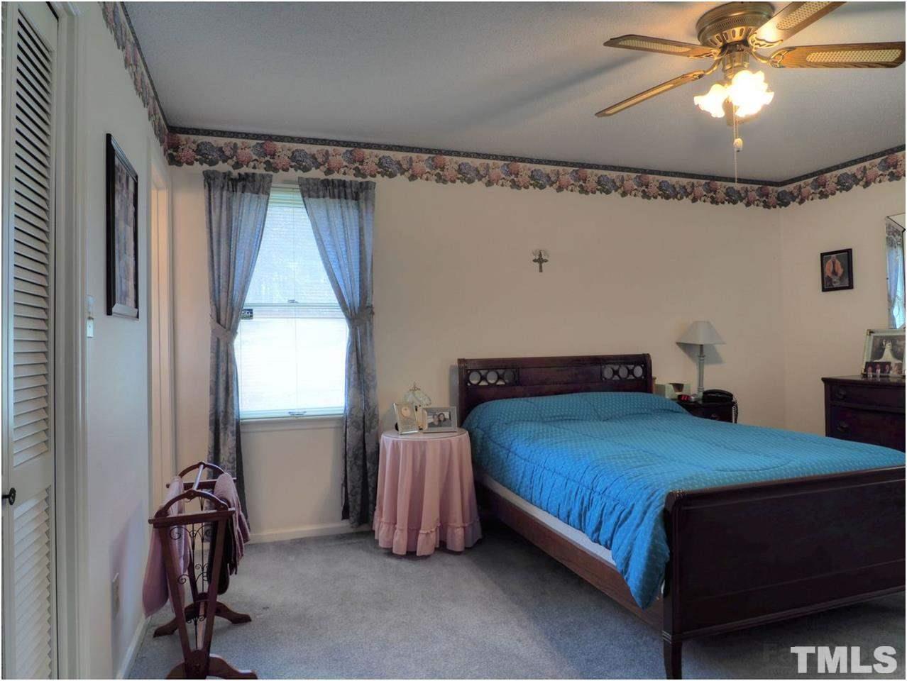 1566 Northside Road Creedmoor, NC 27522 - Photo 13 of 24 Master bedroom with bath