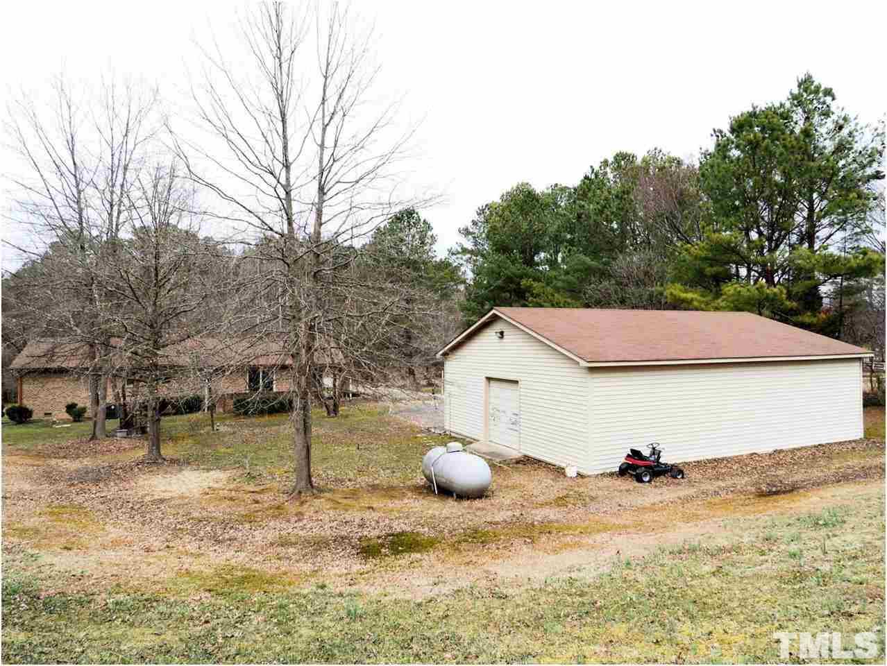 1566 Northside Road Creedmoor, NC 27522 - Photo 17 of 24 View from rear of lot..2-3 stall garage with workshop!! Loads of work and storage areas. Great for car storage, business, hobbies, storage! Raining on your picnic?-just move it inside. So rare to find this type of building and on 2+ acres.....