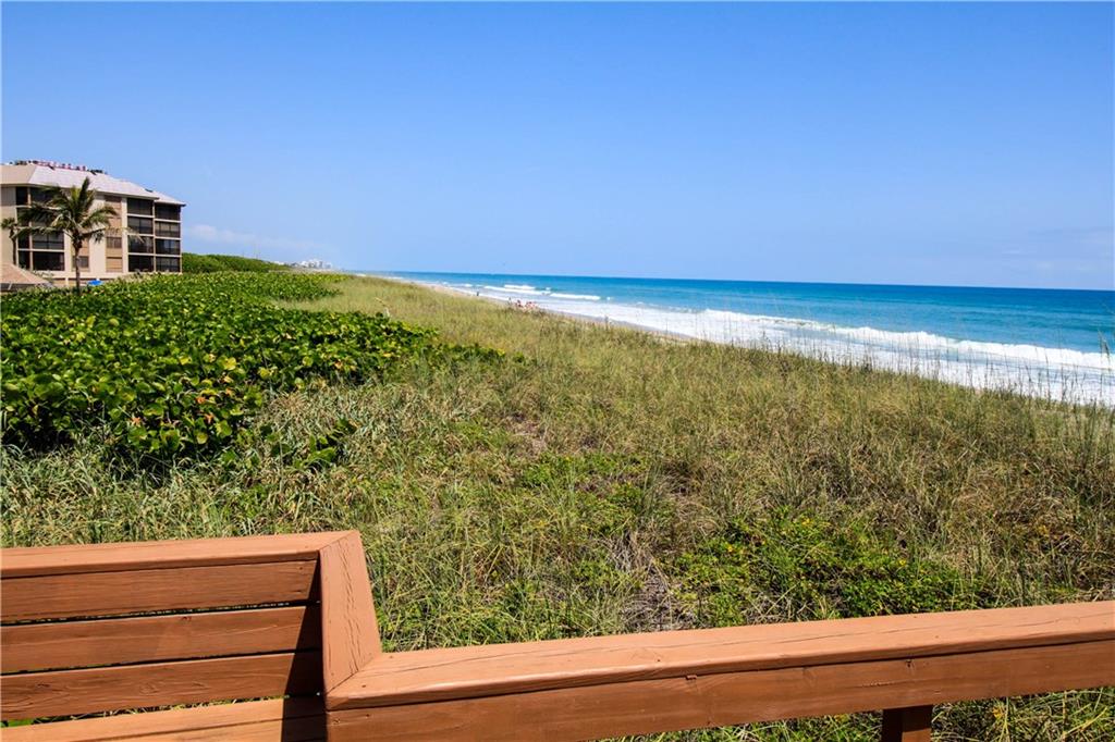 4540 Northeast Sandpebble Trace, Unit 203 Jensen Beach, FL 34957 - Photo 6 of 10 a view of a yard from a balcony