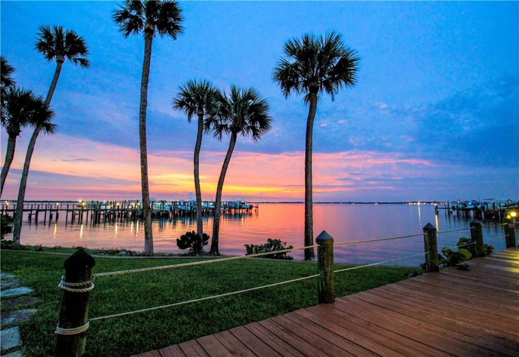 4540 Northeast Sandpebble Trace, Unit 203 Jensen Beach, FL 34957 - Photo 9 of 10 a view of a lake with a garden