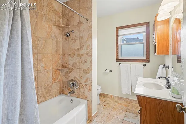 a bathroom with a sink a bathtub and a shower
