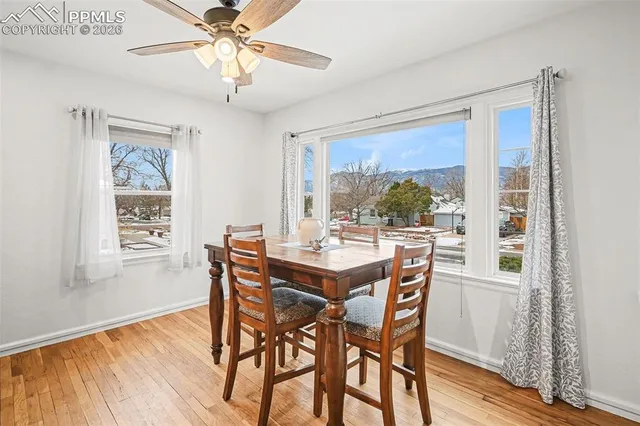 a view of a dining room with furniture window and wooden floor