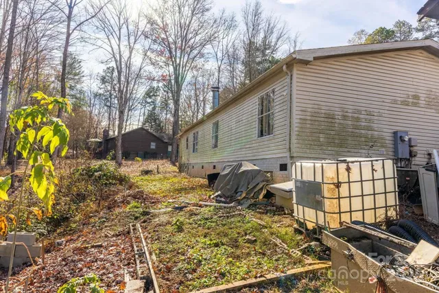 a view of backyard with a chair and table