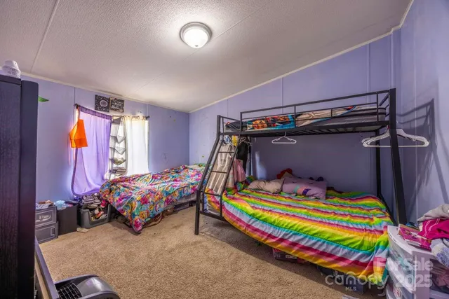 a bedroom with a bed and a small space