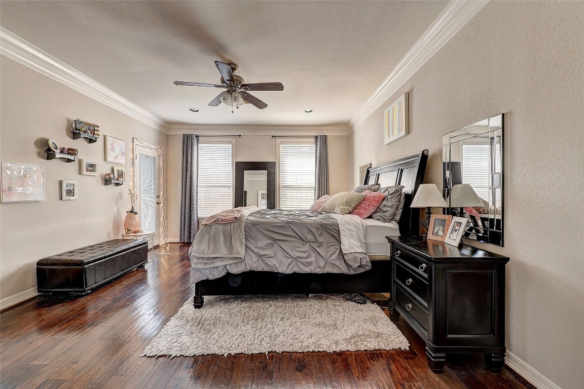 835 Rosine Street Houston, TX 77019 - Photo 2 of 18 a bedroom with a bed and wooden floor