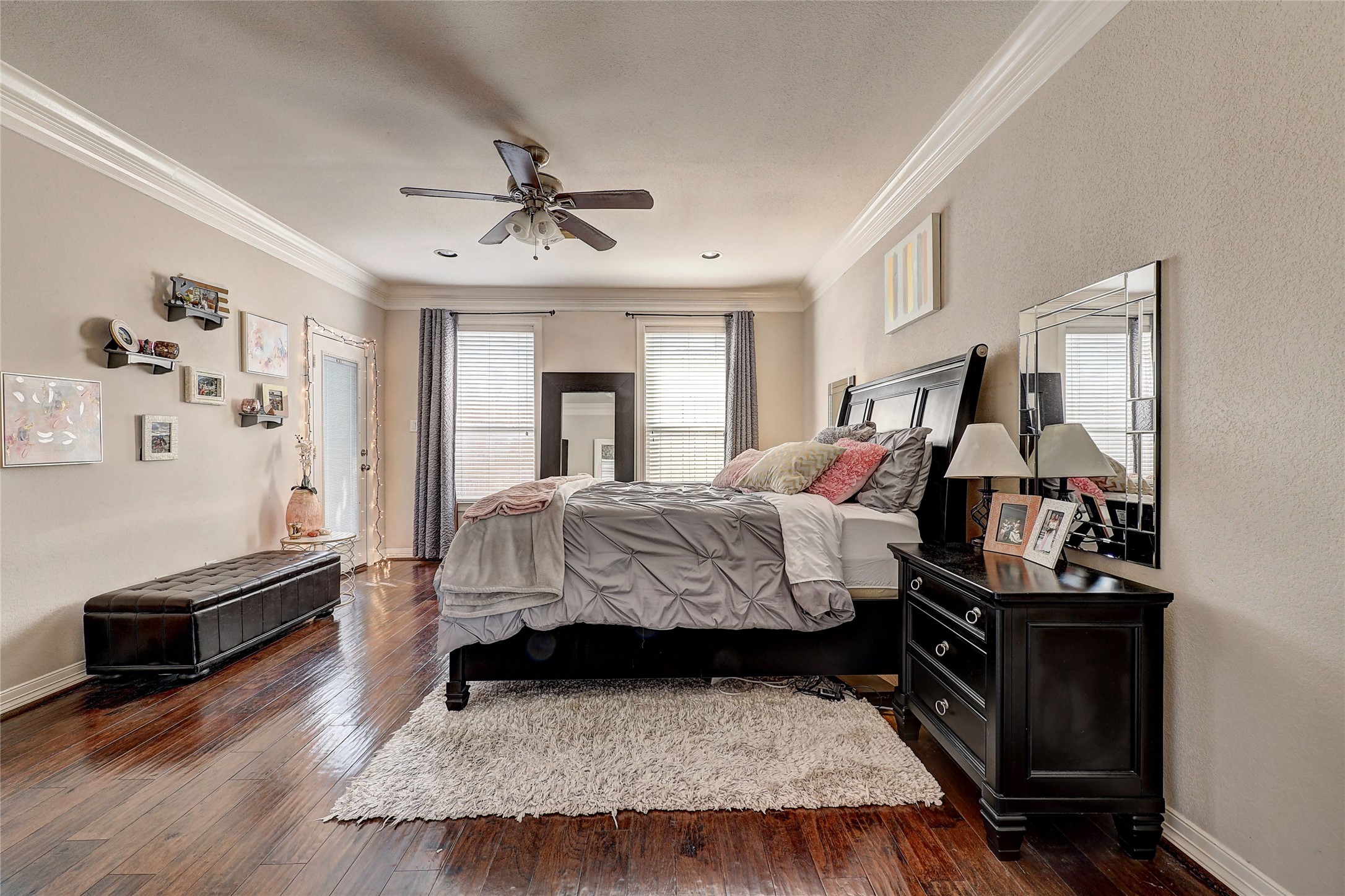 835 Rosine Street Houston, TX 77019 - Photo 2 of 18 a bedroom with a bed and wooden floor