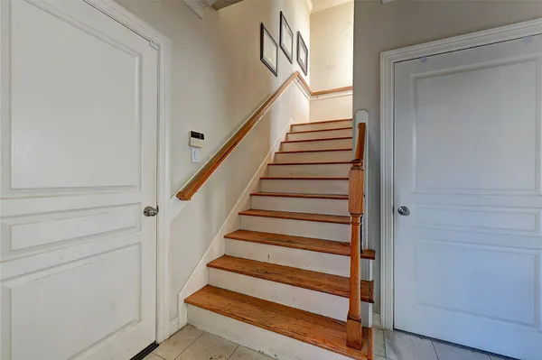 a view of entryway with wooden floor and windows