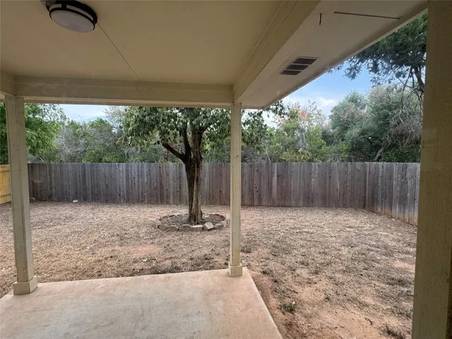 wooden floor in an empty room with a fireplace