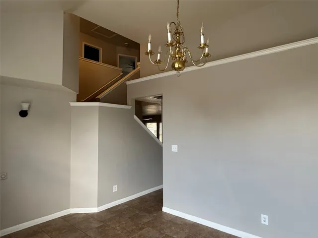 a view of a livingroom with stairs