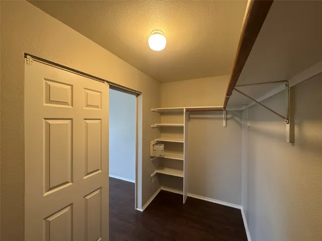 a bathroom with a double vanity sink mirror and toilet