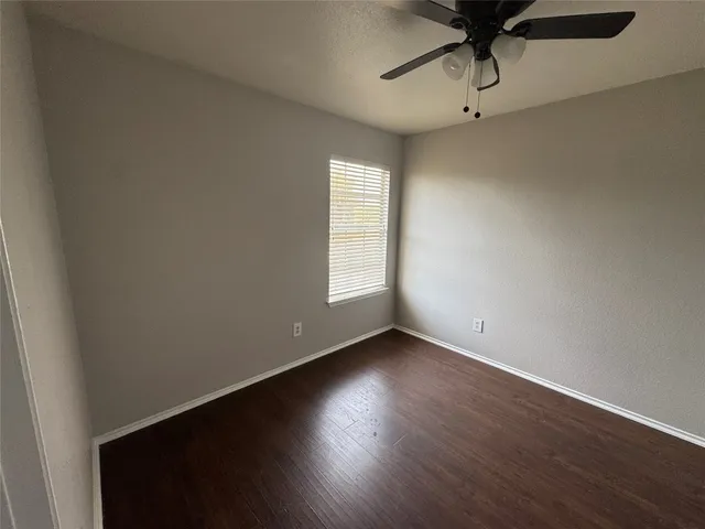 a white toilet sitting next to a sink