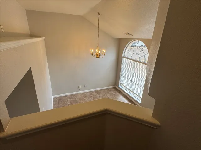 a view of room with window and hardwood floor
