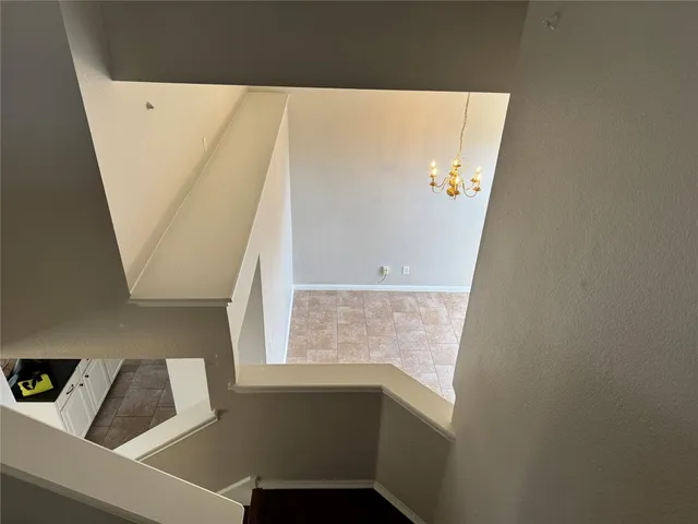 a view of a livingroom with an entryway and fireplace