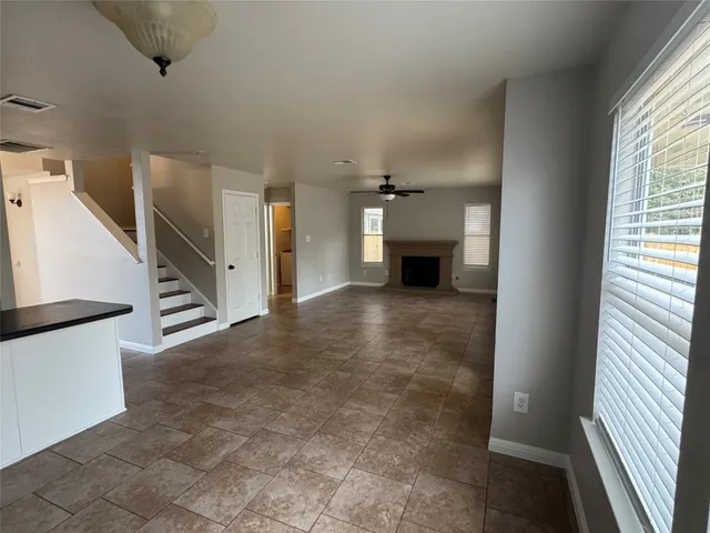 a large kitchen with cabinets and stainless steel appliances