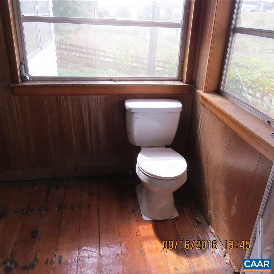1033 Kiddsville Road Waynesboro, VA 22980 - Photo 18 of 33 a white toilet sitting next to a window