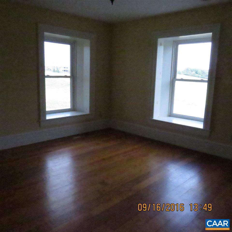 1033 Kiddsville Road Waynesboro, VA 22980 - Photo 29 of 33 an empty room with wooden floor and windows