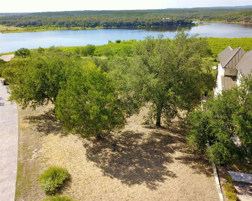 637 Wesley Ridge Drive Spicewood, TX 78669 - Photo 2 of 26 Lot 45 widens at the prime building site, giving room for creativity and design.