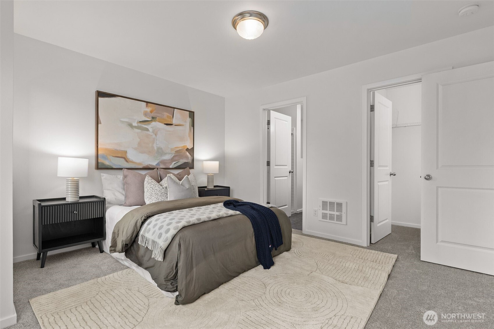16516 2nd Park Southeast Bothell, WA 98012 - Photo 19 of 39 a bedroom with a bed and a lamp