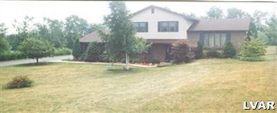 1046 Miller Road Nazareth, PA 18064 - Photo 1 of 33 a view of a house with a yard