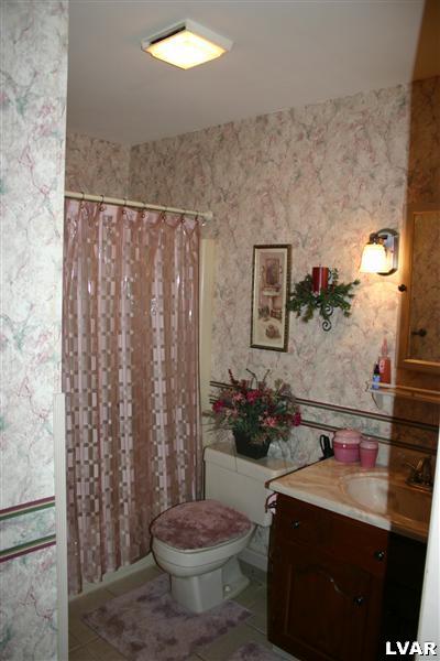 1046 Miller Road Nazareth, PA 18064 - Photo 14 of 33 a bathroom with a sink toilet and shower