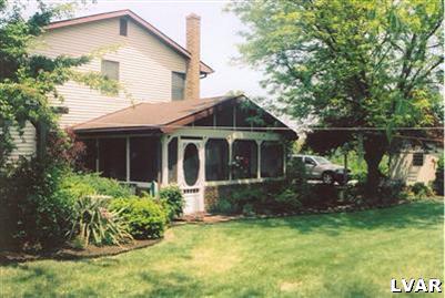 1046 Miller Road Nazareth, PA 18064 - Photo 4 of 33 a front view of a house with garden