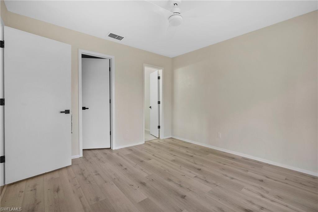 7423 Garry Road Fort Myers, FL 33967 - Photo 16 of 20 wooden floor in an empty room