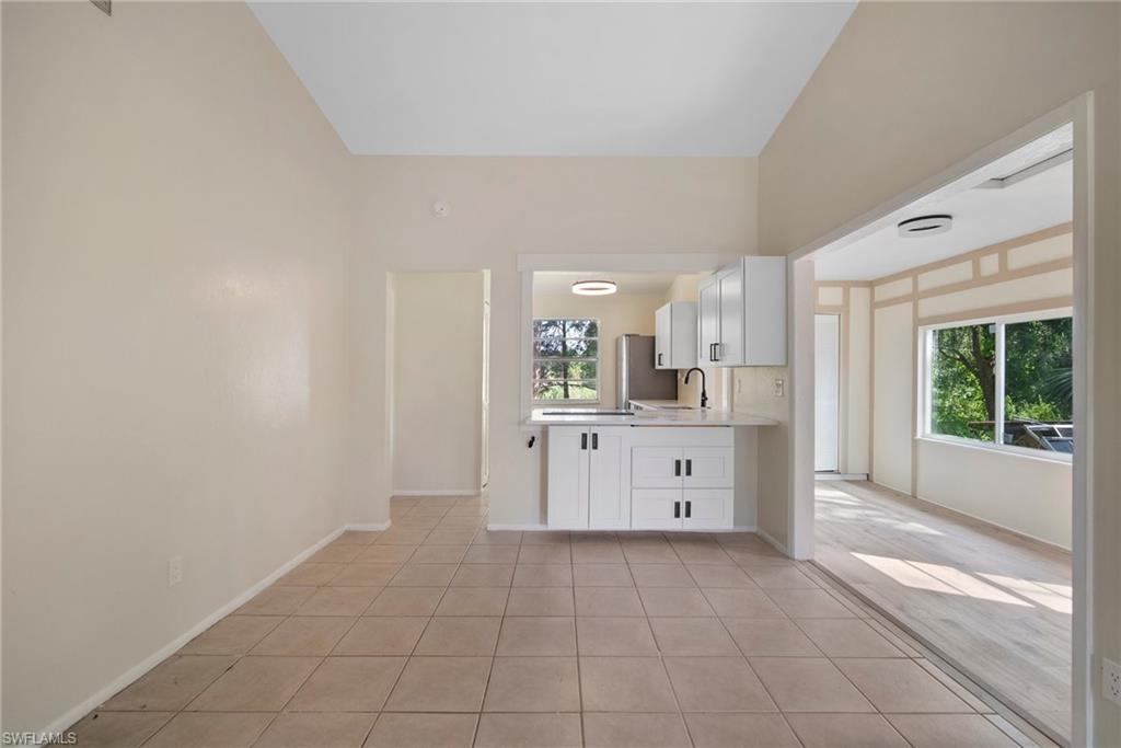 7423 Garry Road Fort Myers, FL 33967 - Photo 6 of 20 a large white room with window and mirror