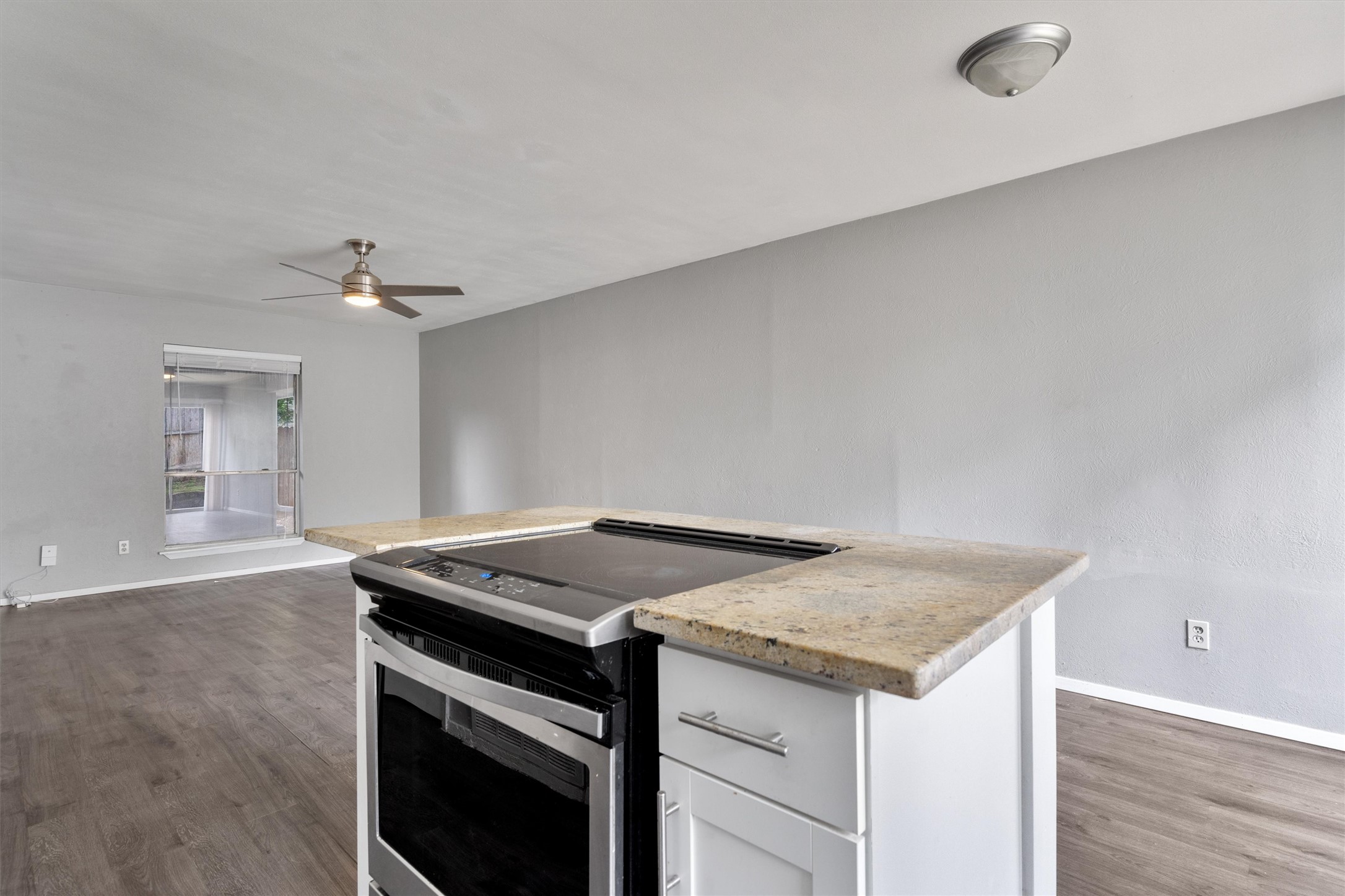3415 Menchaca Road, Unit 113 Austin, TX 78704 - Photo 9 of 21 a kitchen with granite countertop a sink and a stove