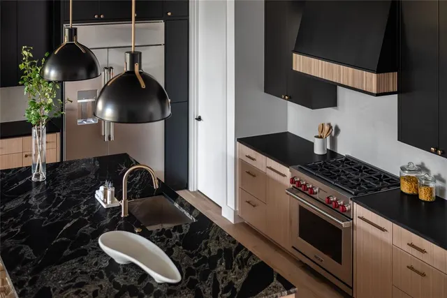 a kitchen with a stove and a sink