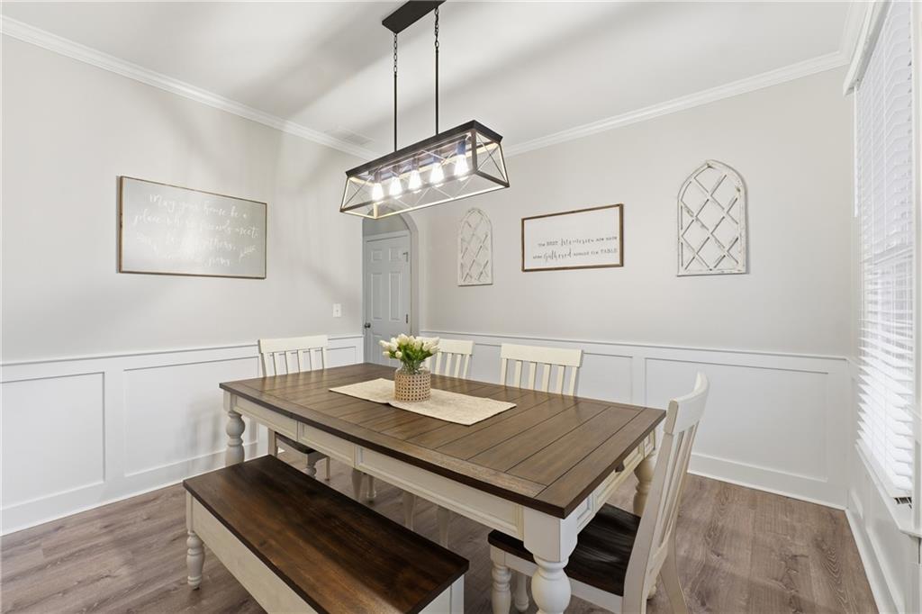 158 Pine Trail Dallas, GA 30157 - Photo 13 of 64 a view of a dining room with furniture and wooden floor