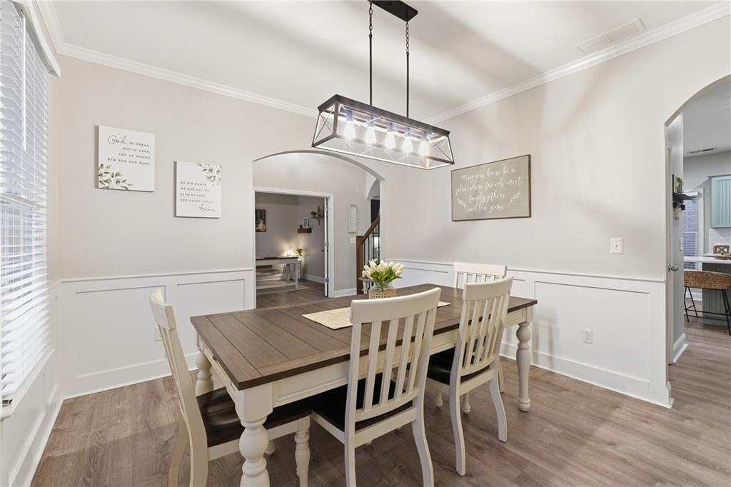 158 Pine Trail Dallas, GA 30157 - Photo 15 of 64 a view of a dining room with furniture a chandelier and wooden floor